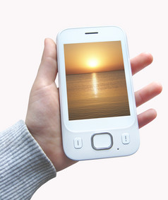 现代智能手机与图像日落以上海洋屏幕手孤立的白色背景移动电话人类手孤立的现代通信现代智能手机与图像日落屏幕手孤立的白色