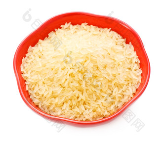红色的碗与大米孤立的白色