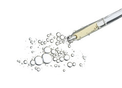 血清石油吸管孤立的白色背景化妆品液体下降吸量管与泡沫前视图