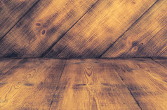 黑暗板材木地板上和墙纹理的角度来看背景为蒙太奇显示你的产品模拟模板为你的设计黑暗板材木地板上和墙纹理的角度来看背景