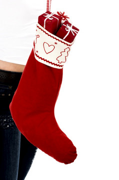 圣诞节季节!不同的提出了美丽的女人与圣诞节袜子完整的小礼物内部