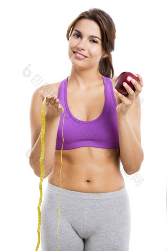 美丽的和健康的女人持有苹果和测量磁带孤立的在白色背景