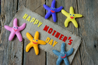 快乐母亲一天与爱你妈妈消息的想法从色彩斑斓的织物海星木背景美丽的花摘要木纹理妈妈。rsquo一天一天为妈妈<strong>爱家</strong>庭