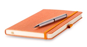 橙色关闭日记与笔孤立的白色背景橙色关闭日记与笔