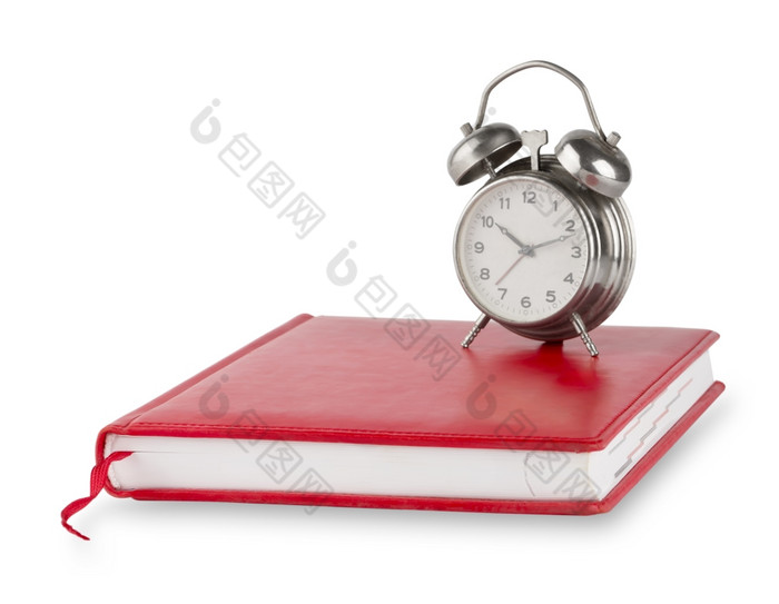 红色的日记和老报警时钟孤立的白色背景红色的日记和老报警时钟