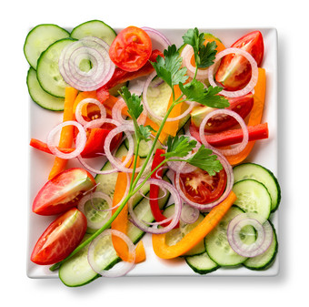 沙拉切片生新鲜的蔬菜白色板孤立的白色背景视图从以上的概念健康的自然食物沙拉切片生新鲜的蔬菜白色板
