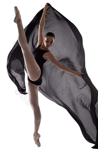 优雅的芭蕾舞女演员执行跳舞元素与黑色的布孤立的白色背景工作室摄影的概念美和格蕾丝优雅的芭蕾舞女演员执行跳舞元素与黑色的布