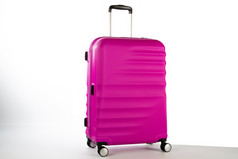 旅行手提箱与白色背景旅行手提箱与非常引人注目的颜色和白色背景