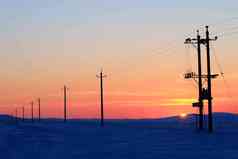 内蒙古额尔古纳市乡村雪景电线杆写实摄影图