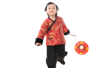 一个小男孩手提红色灯笼庆祝新年东方人高端相片