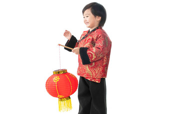 一个小男孩手提红色灯笼庆祝新年唐装高质量场景