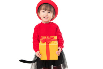可爱的小女孩拿着新年礼物帽子氛围相片
