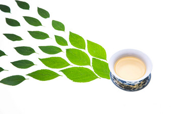 绿色的茶叶和茶杯纹理高端相片