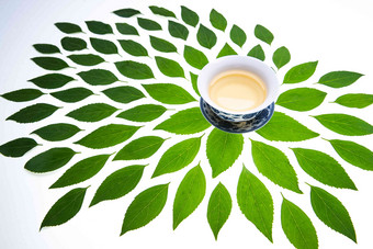 绿色的茶叶和茶杯热饮高清影相