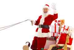 圣诞老人坐在雪橇上招手