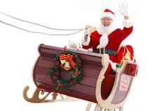 圣诞老人坐在雪橇上招手