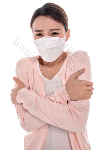 生病的青年女人戴口罩防流感口罩高端照片