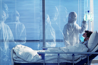 患者躺在医院病床上病毒氛围摄影