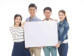 四个年轻的大学生拿着白板团结写实图片