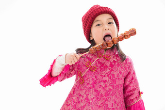 欢乐的小女孩吃糖葫芦中国文化高质量摄影