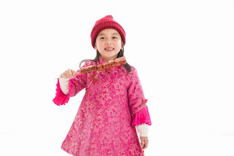 欢乐的小女孩吃糖葫芦摄影高清摄影