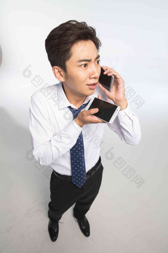 商务电话一个人东方人忙碌高清摄影图