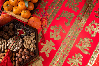 桔子和中式坚果果盘红色写实照片