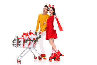 圣诞节推<strong>购物车</strong>的年轻情侣包装盒清晰素材