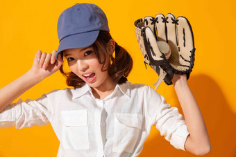 年轻女孩棒球棒球运动东方人高兴的