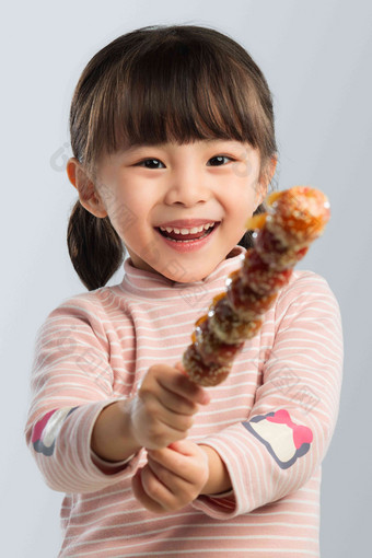 小女孩吃糖葫芦儿童氛围影相