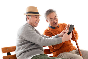 两位老年朋友坐在长椅上看<strong>手机</strong>中国写实相片