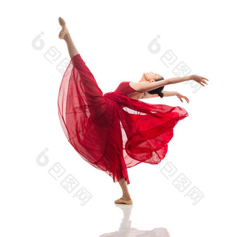 穿红色裙子跳芭蕾舞的青年女人优雅写实相片