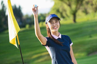举着高尔夫球的青年女人乐趣写实素材
