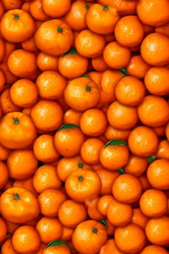 清洗水果水滴柑橘背景摄影图特写摄影黄色