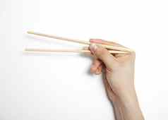 男人的手引人入胜的筷子白色背景