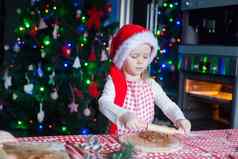 女孩圣诞老人他滚动销烘焙姜饼饼干