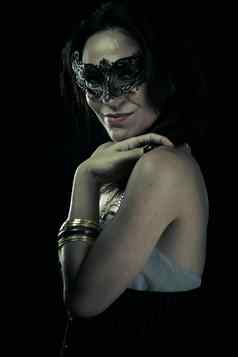 部落美丽的年轻的女人神秘的黑色的威尼斯面具