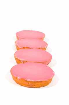 粉红色的上釉饼干堆放