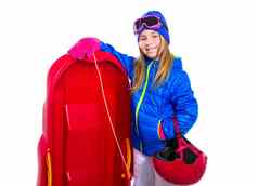 金发碧眼的孩子女孩红色的雪橇雪设备头盔护目镜
