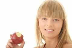 年轻的金发碧眼的女人红色的苹果