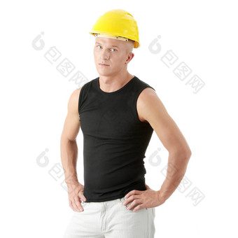 年轻的英俊的构建器黄色的头盔