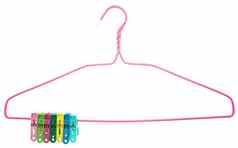 色彩斑斓的衣服挂钩夹紧的粉红色的悬挂器孤立的