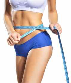 女人测量腰围完美的苗条的身体饮食