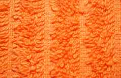 纹理明亮的橙色特里毛巾特写镜头