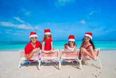 家庭圣诞老人帽子有趣的热带海滩