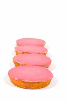 粉红色的上釉饼干堆放