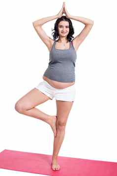 活跃的年轻的怀孕了女人瑜伽