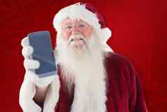 复合图像圣诞老人老人显示智能手机