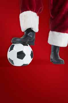 复合图像圣诞老人老人玩足球