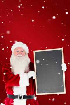 复合图像圣诞老人老人显示黑板上